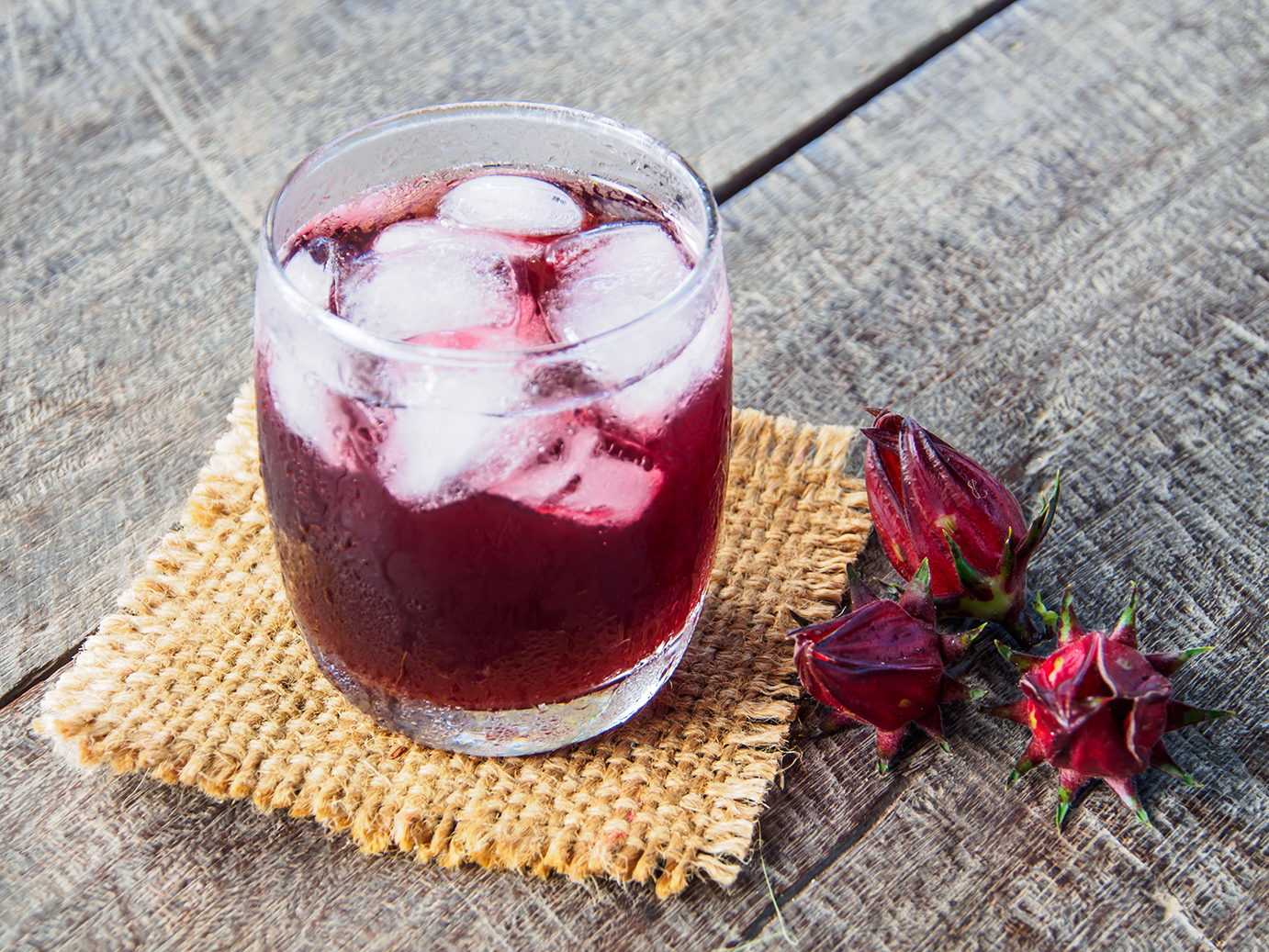 Roselle juice on wooden Different Types Of Edible Flowers
